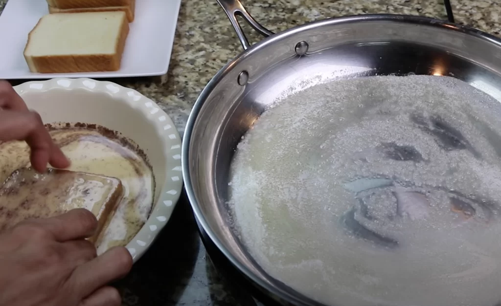 dipping the bread for French toast recipe